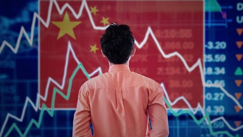 Man looking at a chart of economic or price trends with a Chinese flag in the background.