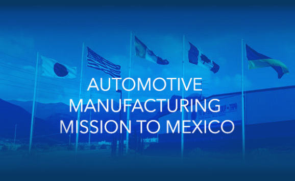 Automotive manufacturing mission to Mexico summit with the building of the Offshore group in the background.