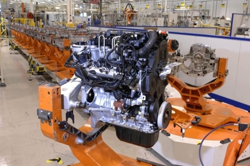 An automated arm works to build a new automobile component in the most efficient of ways.