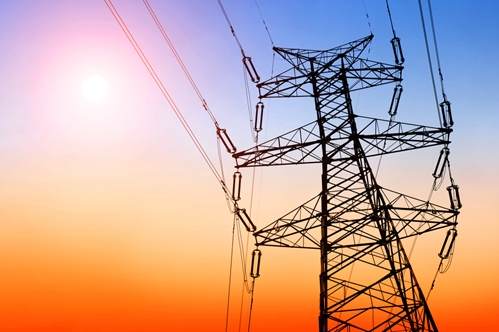 An upward view at a large power tower showing that the energy sector is changing with Nieto's new bill.