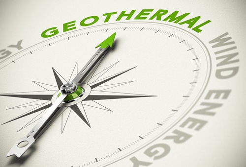 A clock with the words geothermal and wind energy in place of the numbers