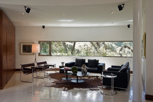 There is a large living room filed with furniture that was all built and manufactured in Mexico.