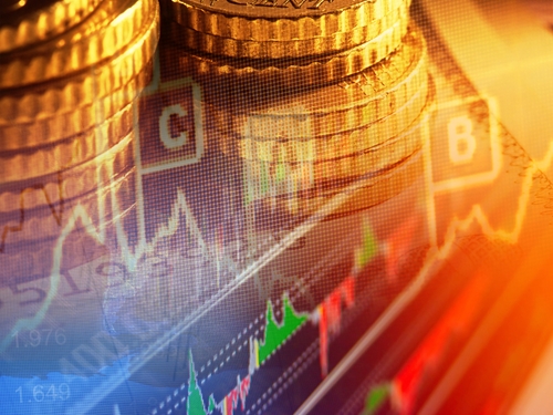 A picture of a graph is overlaid on a picture of stacks of Mexican pesos.