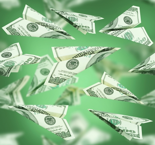 zdollar bills being thrown in the air, and then dropping to the floor.