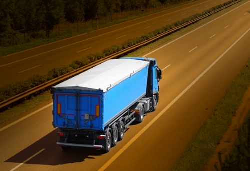 TA large truck transporting manufactured goods from Mexico to the United States.