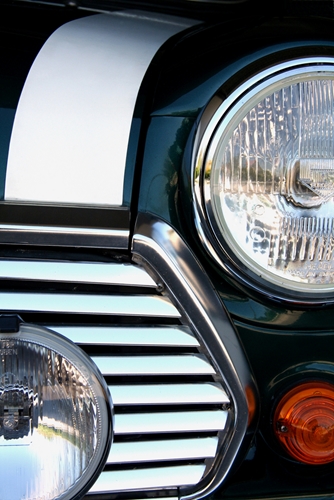 A view at a headlight of a car that was manufactured in Mexico.