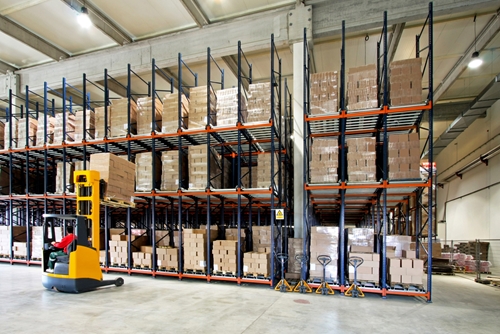 A picture of a large warehouse where boxes upon boxes are stored safely.