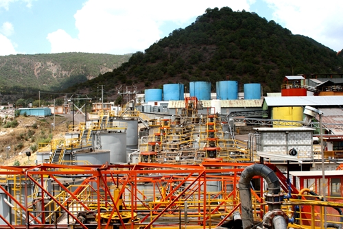 The creation of a factory in front of a mountain overlooking a beautiful landscape.