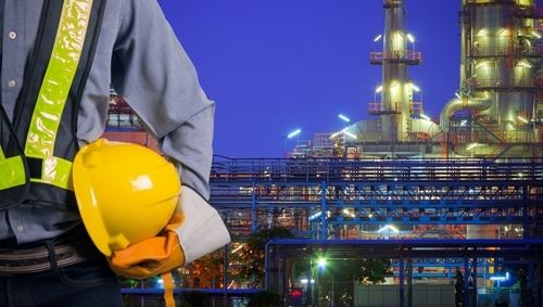Image of a skilled laborer eager to begin work in a manufacturing facility located in Mexico.